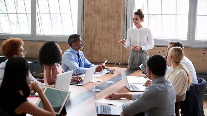 Business professionals led by woman